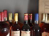 several bottles of wine are lined up on a table