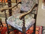 a chair that is sitting on a rug in a room