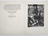an open book with a black and white drawing of a man sitting on the ground