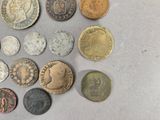 a lot of coins that are sitting on a table