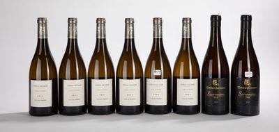 six bottles of wine lined up in a row on a table
