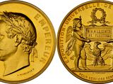 Gros plan sur une pièce d'or représentant un homme.