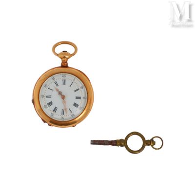 a gold pocket watch and a key on a white background