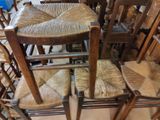 a lot of chairs that are stacked on top of each other