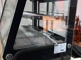 an image of a glass display case in a kitchen