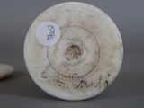 a picture of a white vase with writing on it