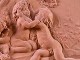 a picture of a relief of a woman and two children