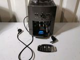 a coffee machine that is connected to a charger on a table
