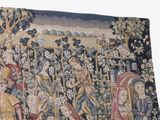 a tapestry with a picture of a group of people in a field