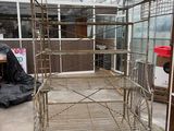a metal bed that is in the middle of a room