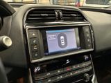 the dashboard of a car with a digital display in the center of it