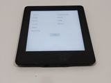 the tablet is sitting on the table with the screen on it