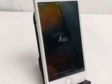 a cell phone that is sitting on top of a stand