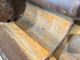 a rusted metal sink with a rusted metal faucet in it