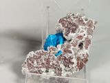 a piece of rock with a blue substance on top of it