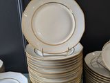 many plates stacked on top of each other on a table