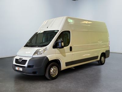 a picture of a white van parked in a room