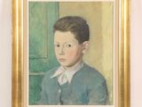 portrait of a young boy in a blue sweater and white collared shirt