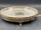 an antique brass plate with handles and handles on a black background