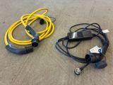 two wires connected to a power cord on the floor
