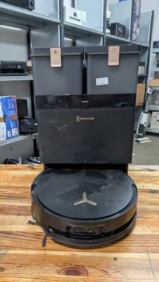 an image of a robotic vacuum cleaner on a wooden table