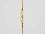 an image of a gold spoon with a handle on a white background