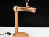 a wooden lamp that is on top of a table