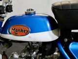 a blue and white motorcycle parked in a garage