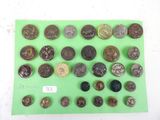 a lot of old coins on a green surface