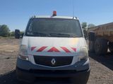 a white van that is parked in the dirt