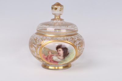 a glass jar with a picture of a woman on it