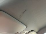 a close up of a cell phone attached to the back of a car