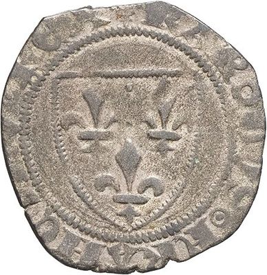 a silver coin with an image of a lion on it