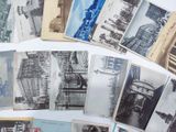 a lot of old postcards that are on a table