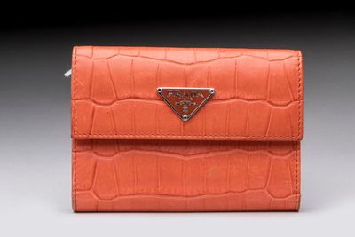 prada wallet in orange crocodile embossed leather