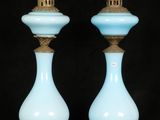 pair of blue glass candlesticks with gold trim