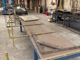 many tables that are lined up in a warehouse