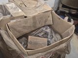 a pile of boxes sitting on the floor next to a heater