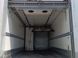 a large white truck that is parked in a lot