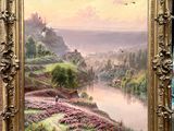 peinture d'un paysage avec une rivière et un château au loin