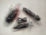 four different types of hair brushes wrapped in plastic