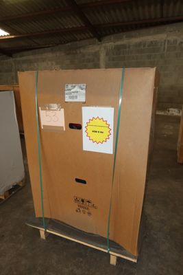 a cardboard box that is sitting on a pallet in a warehouse