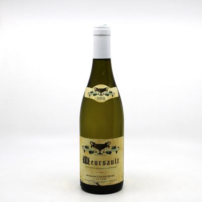 a bottle of wine that is sitting on a table