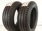 a pair of tires on a white surface with a red and white background