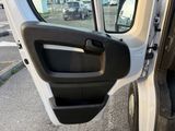 a white van with the door open on the side of the road