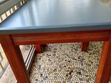 a long table that has a blue top on it