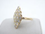 a close up of a gold ring with diamonds on it