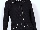 Chanel - veste matelassée noire avec poignets et manchettes en cuir