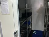 a blue mat on the floor in the kitchen