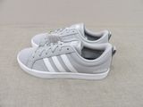 grey and white adidas sneakers with laces on the sole
